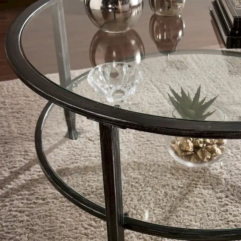 Table basse ronde en métal noir vieilli avec plateau en verre et étagère